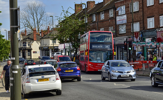 London, United Kingdom, June 14 2018. Also on the outskirts of London, in Colindale, you can see the famous red London buses. Here line 142 Watford Junction.