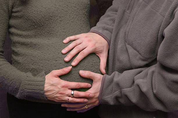 istock Hand on pregnant belly 115074011