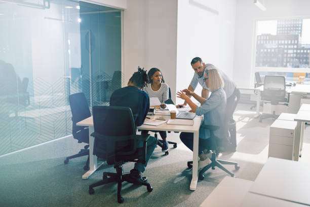 istock Work colleagues discussing business together during an office meeting 1150741045