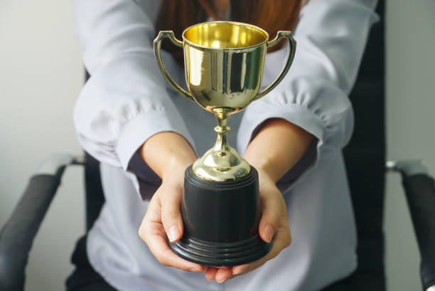 istock Business woman give trophy,win concept. 1150741325