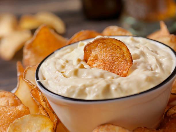 French Onion Dip with Hand Made Potato Chips French Onion Dip with Hand Made Potato Chips and a Beer mayonnaise photos stock pictures, royalty-free photos & images