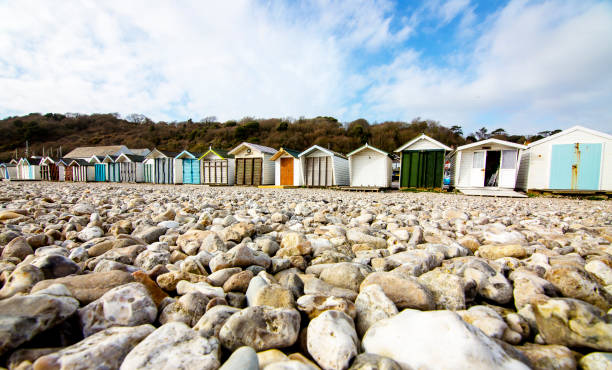 istock Beach huts sitting along a pebbled beach no people 1150741957