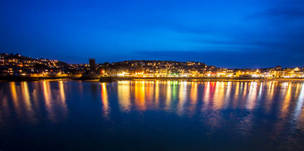 istock Colourful reflections from the shops and street lights 1150741962