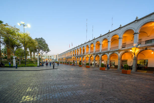People enjoying time outside at Plaza de Armas square in Arequipa, Peru, an early evening.
