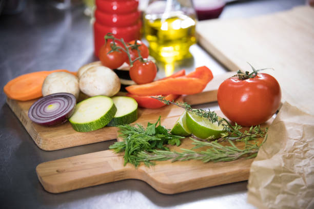 istock Restaurant kitchen. Fresh vegetables on the wooden desk 1150744204