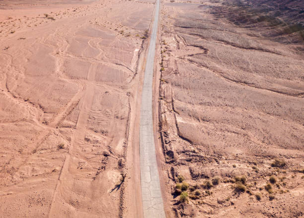 istock Old Desert road with cracked asphalt 1150744904