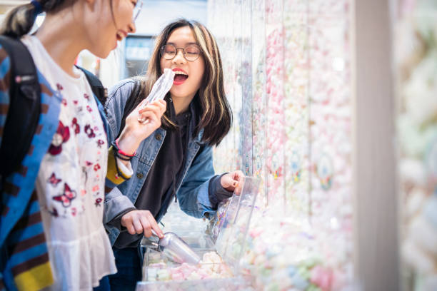 istock Cute Asian girls in a candy store 1150746374