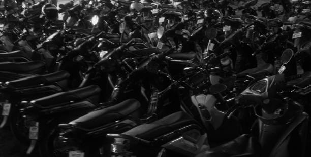 istock scooters parked in dense rows, beautiful night lighting, soft focus, background 1150746378