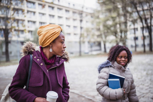 istock Two female, students rushing to the class 1150747522