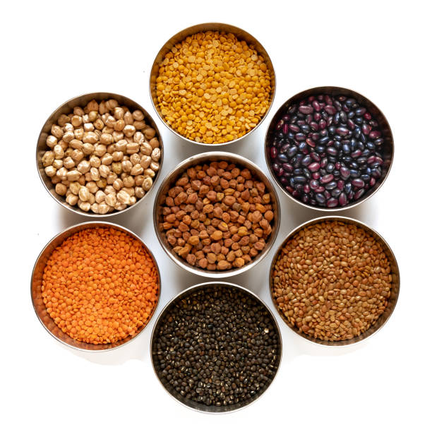 istock Legumes in steel bowel isolated on white background. 1150752081