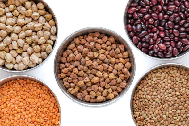 istock Legumes in steel bowel isolated on white background. 1150752445