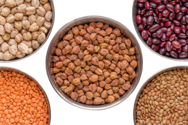 istock Legumes in steel bowel isolated on white background. 1150752457