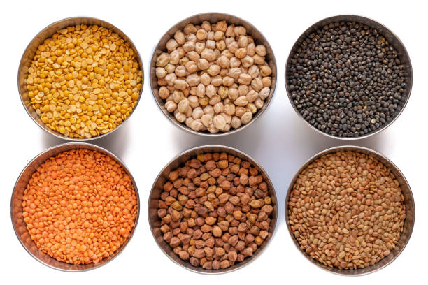 istock Legumes in steel bowel isolated on white background. 1150752829