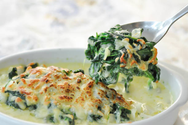 Baked spinach or Baked spinach with cheese stock photo