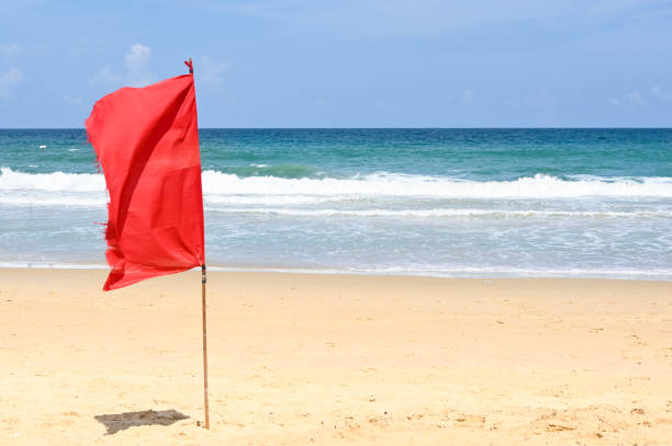 istock Karon beach with red flag, Phuket, Thailand 1150757351