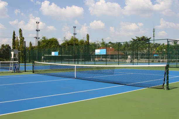 istock Tennis court outdoors with net in daylights 1150757810