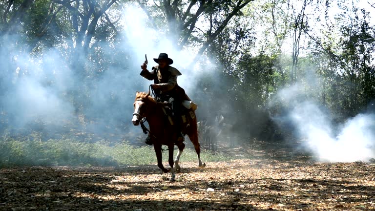 Slow Motion Shot Of Cowboy Riding Horse Running Through The Forest