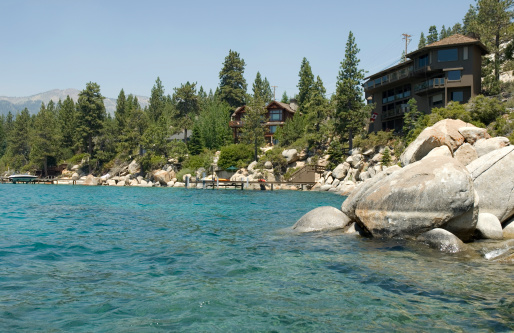 Large, expensive houses adorn the shoreline of Lake Tahoe.