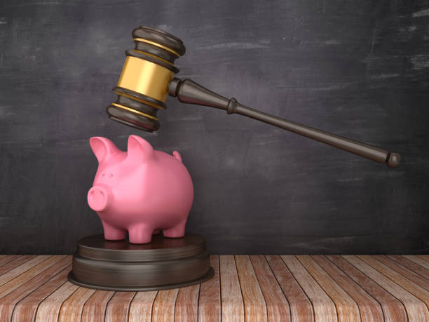 istock Gavel with Piggy Bank on Chalkboard Background - 3D Rendering 1150760010