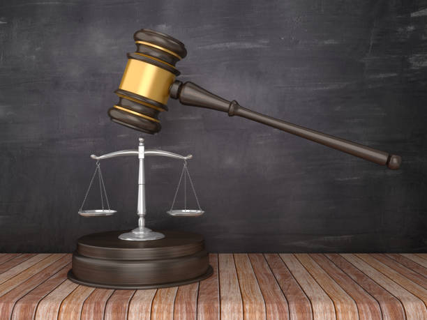 istock Gavel with Scales of Justice on Chalkboard Background - 3D Rendering 1150760051