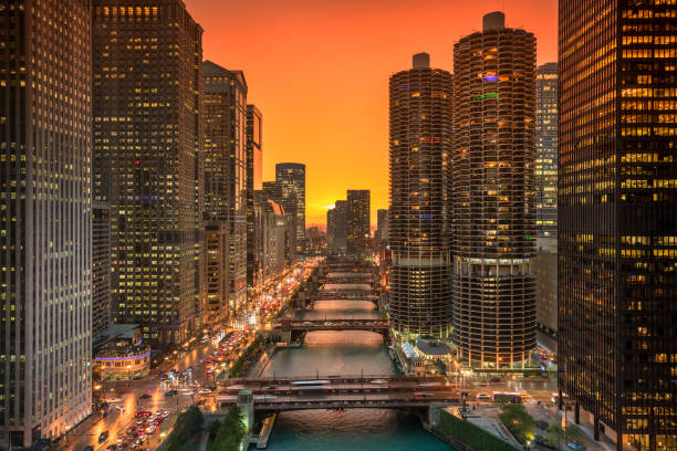Chicago cityscape and bridges over the river at night Downtown city buildings and skyline over the Chicago River at night in Illinois USA michigan avenue chicago stock pictures, royalty-free photos & images