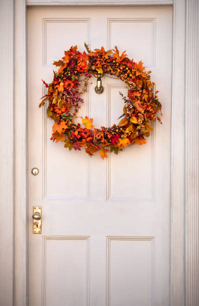 istock Autumn wreath hanging on a front door 1150763436