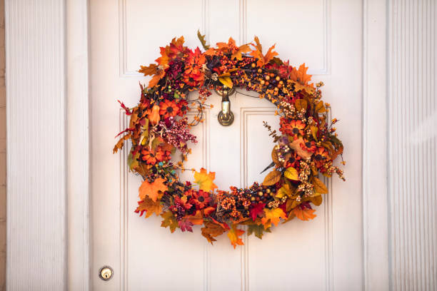 istock Autumn wreath hanging on a front door 1150763448