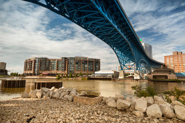 Downtown Cleveland city skyline in Ohio USA Day time cityscape of urban Cleveland Ohio USA over the Cuyahoga river and the Flats cuyahoga river photos stock pictures, royalty-free photos & images