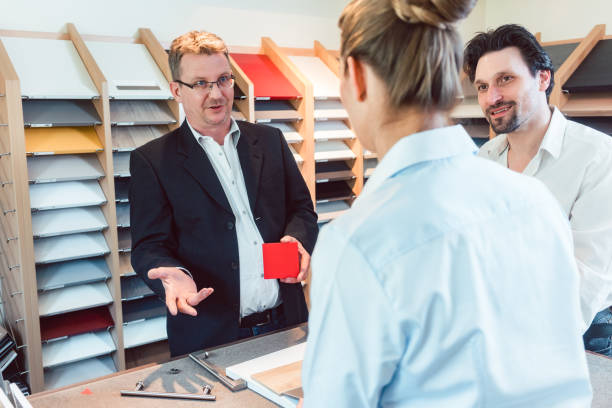istock Salesman explaining options for colors and materials of new kitchen 1150763643