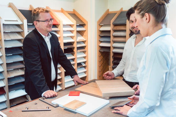 istock Salesman explaining options for colors and materials of new kitchen 1150763693