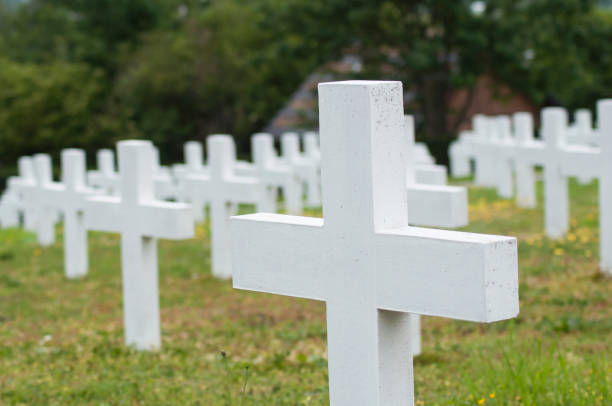 istock white cross alignment at military cemetery 1150763858