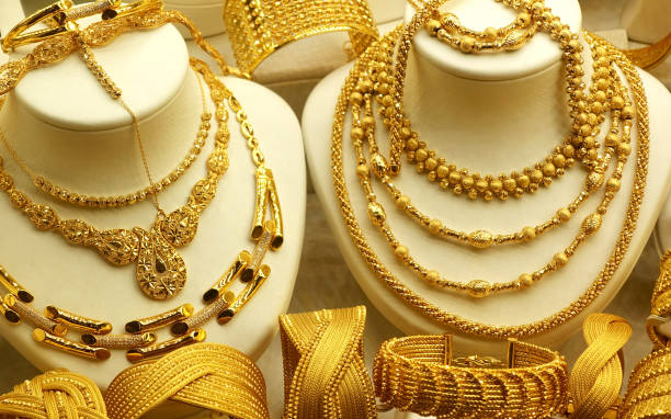 istock Gold necklaces, rings on stands 1150766913