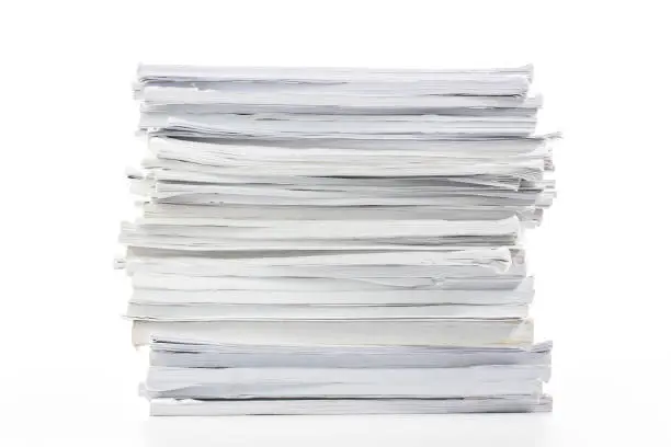 Photo of Close-up of papers stack isolated on a white background