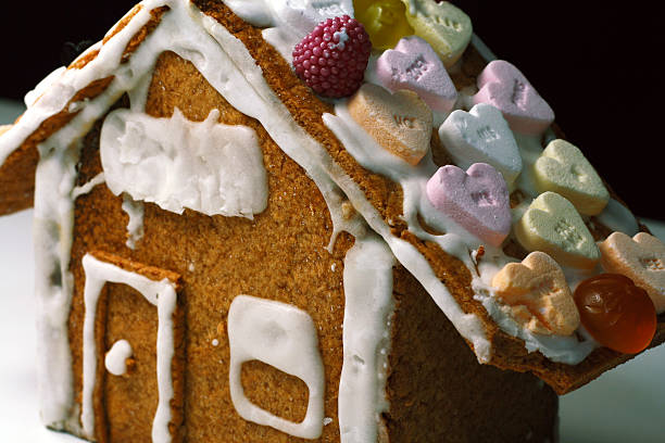 A nice Hansl und Gretel Gingerbread house, with one bite taken.