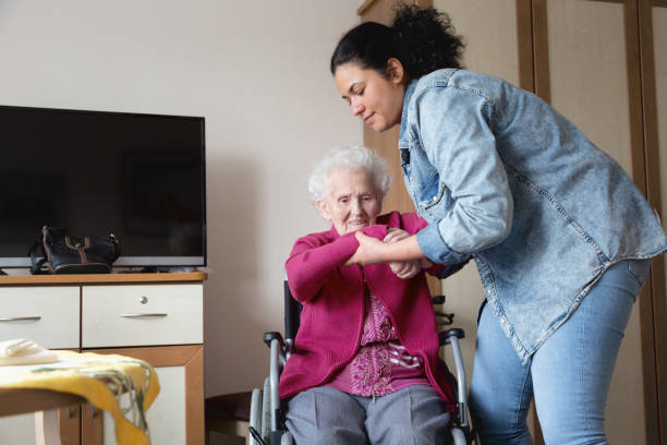istock Senior adult getting support from caregiver 1150769344