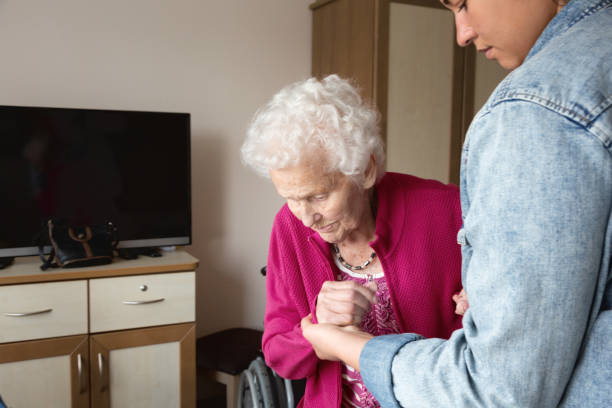 istock Senior adult getting support from caregiver 1150769419