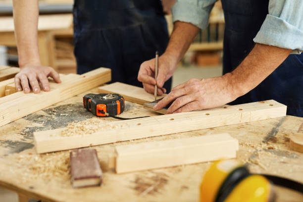 istock Carpenter Marking Wood Closeup 1150770085