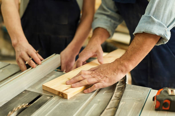 istock Carpenters Cutting Wood Closeup 1150770117