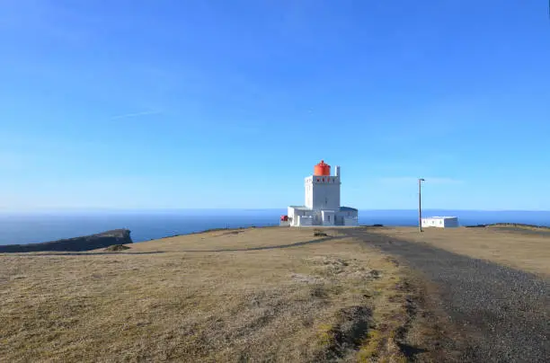 Sunny blue skies over Dyrholaey Lighthouse in Iceland.