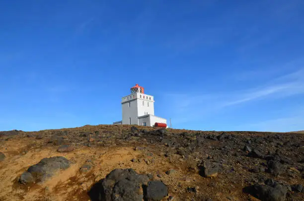 Dyrholaey Lighthouse on the top of the sea cliffs in Iceland.