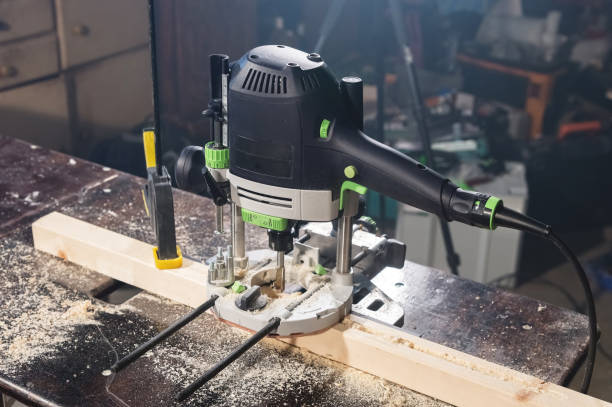 istock Close-up electric router milling machine in a dark room 1150771748