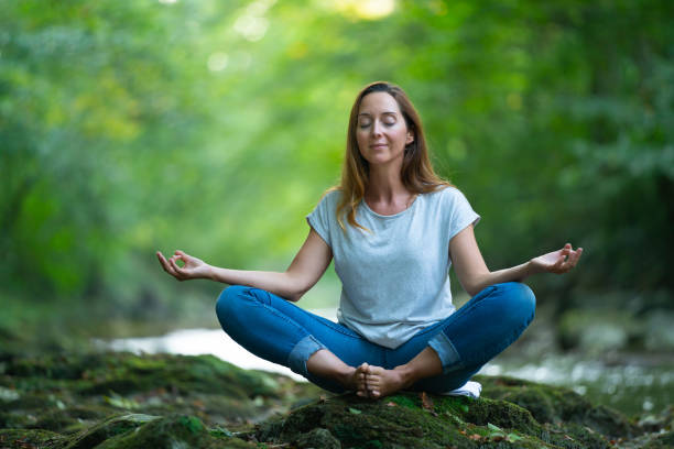 istock peaceful nature woman yoga 1150772945