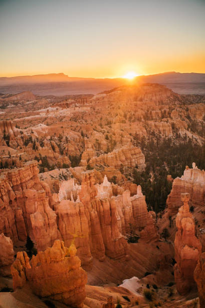 istock Sun rises over rock formations in the desert 1150773441