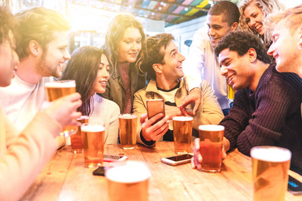 happy millennial friends at pub drinking beer - beer pub women pint glass imagens e fotografias de stock
