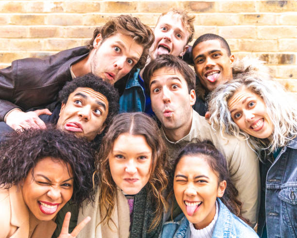 istock Multiracial friends taking selfie and making funny faces 1150774274