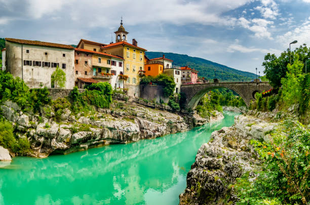 Beautiful ancient mediterranean town with stone arch bridge and emerald river. Kanal town in Slovenia Beautiful ancient mediterranean town with stone arch bridge and emerald river. Kanal town in Slovenia kanal stock pictures, royalty-free photos & images