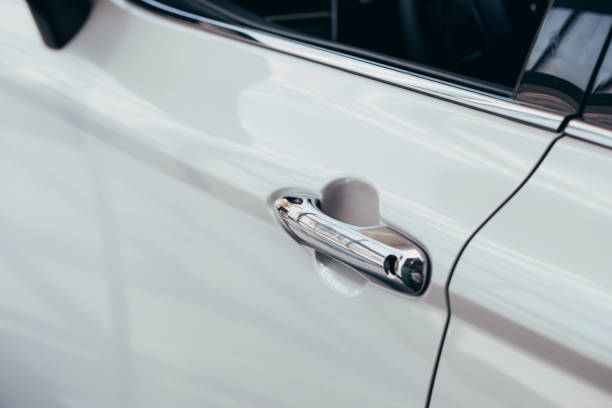 istock Closeup of white car door handle 1150776669