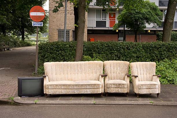 istock Used couches and broken tv on the sidewalk 115077992
