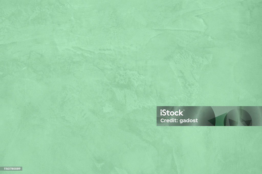 Neo mint concrete textured background Trendy Neo mint colored low contrast Rough Concrete textured background to your concept or product. Color of the year 2020 2020 Stock Photo