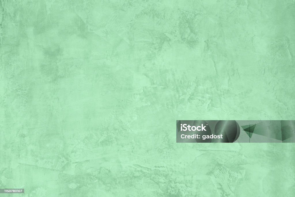 Neo mint concrete textured background Trendy Neo mint colored low contrast Rough Concrete textured background to your concept or product. Color of the year 2020 2020 Stock Photo